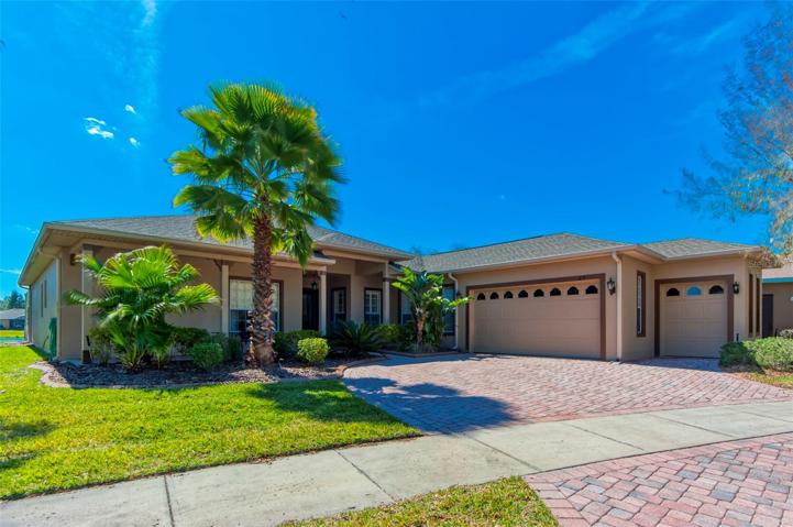 Large driveway, 2 car garage and golf cart garage