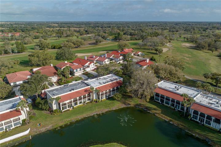 iAerial view of bldg & golf course