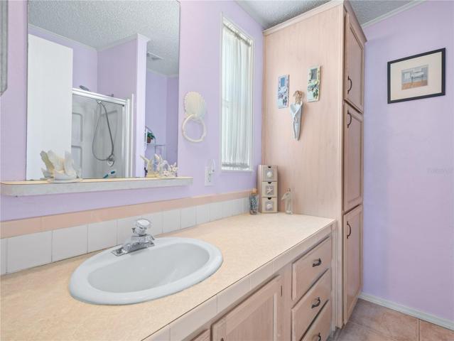 Ensuite bathroom has a shower stall.