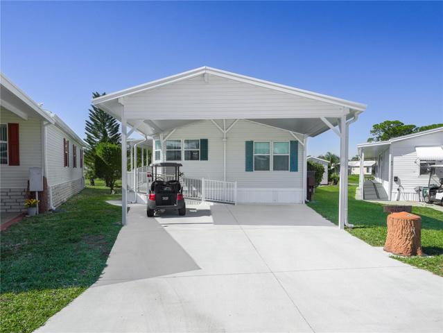 The new driveway and carport accommodates two vehicles, and there's even a handicap ramp.