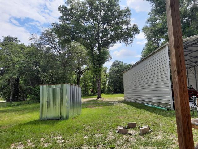 Well House and Steel Building view from Pole Barn