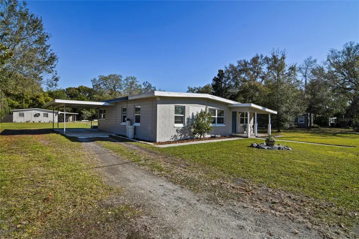 HALF ACRE LOT in the heart of East Orlando with a 3BD/1BA MAIN HOME, 2BD/1BA detached GUEST HOUSE and NO HOA!