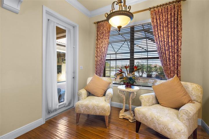 SITTING AREA/ DOOR OUT TO LANAI & POOL