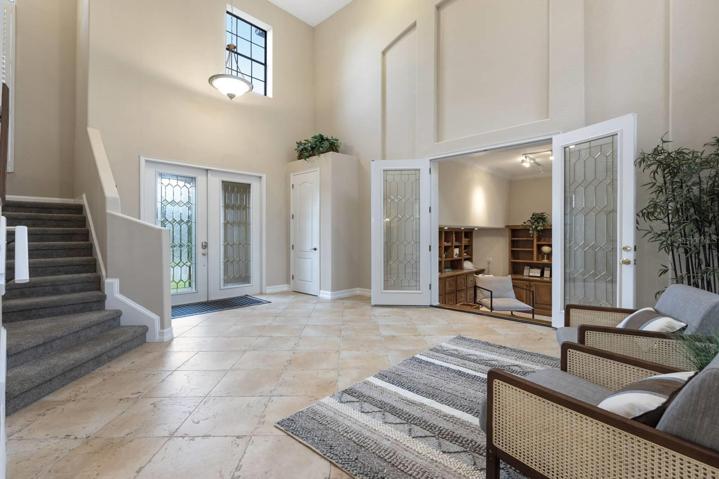 This grand entryway warmly welcomes you into this gorgeous home