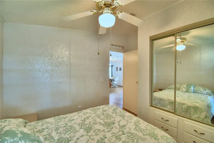 Guest bedroom has built-in closets and drawers.