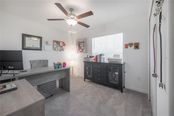 Secondary bedroom set up as an office.