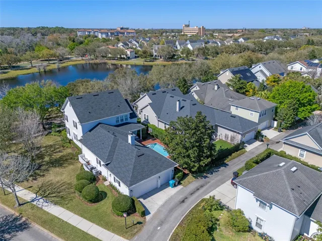Aerial shot showing huge side yard (can be fenced with HOA approval) and 3 car garage