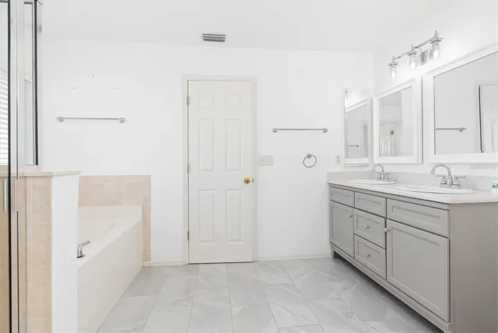 Master bathroom and door to bedroom