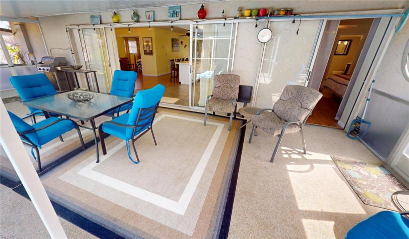Covered/screened pool enclosure with access to primary bedroom