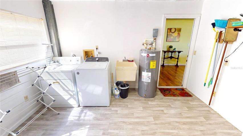 Laundry area within the attached 1-car garage