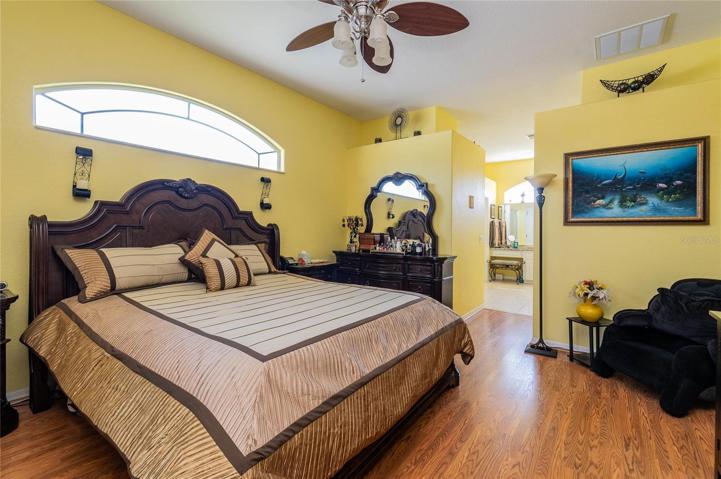 Primary bedroom with primary walk in bathroom