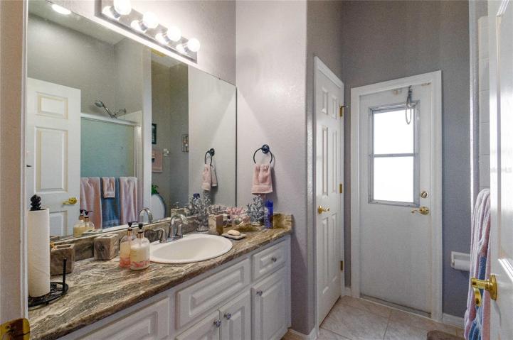 Bathroom with door to access from pool
