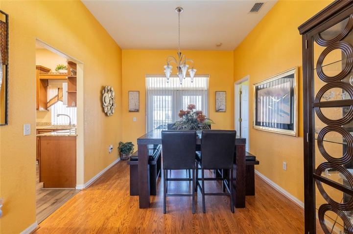 Dining area off kitchen with french doors that lead to the lanai and pool.