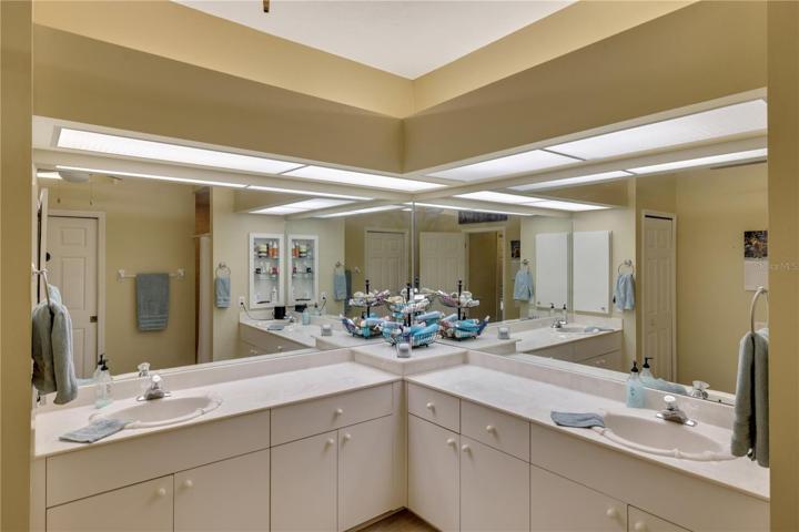 Dual vanities-spacious primary bathroom with walk in shower.