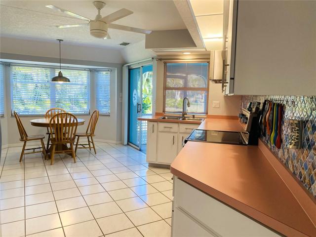 Kitchen with Kitchen Nook and Sliders to Lanai