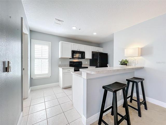 Kitchen of Apt. with Breakfast Bar