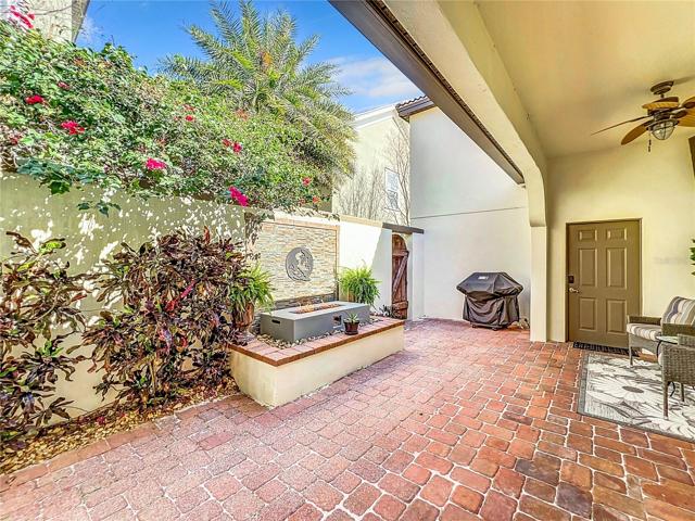 Lanai with Covered Area & Door to Side Yard and to Garages