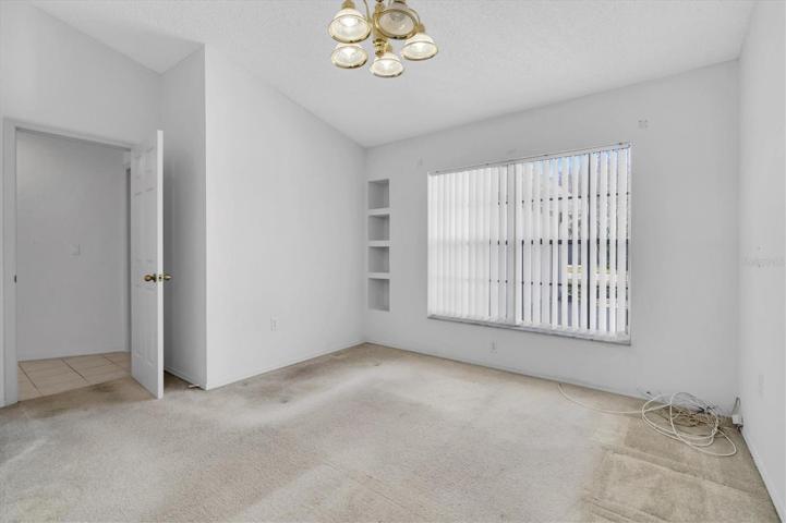 bedroom #3, front of the home, sliders to great room