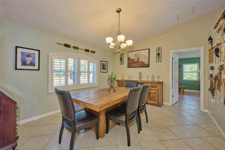 Formal dining room.  Door in back leads into master bedroom suite