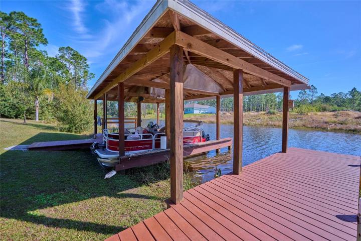 Covered boat dock has two slips!