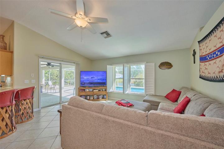 Living room has sliders that lead out to patio and pool area!  Look at those views!