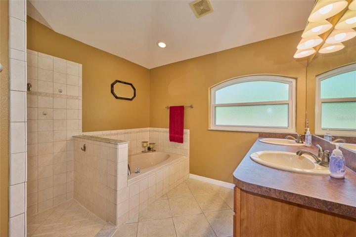 Master ensuite has a garden tub, separate shower, double sink vanity, water closet and walk-in closet
