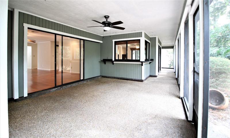 Screened porch along back of the house