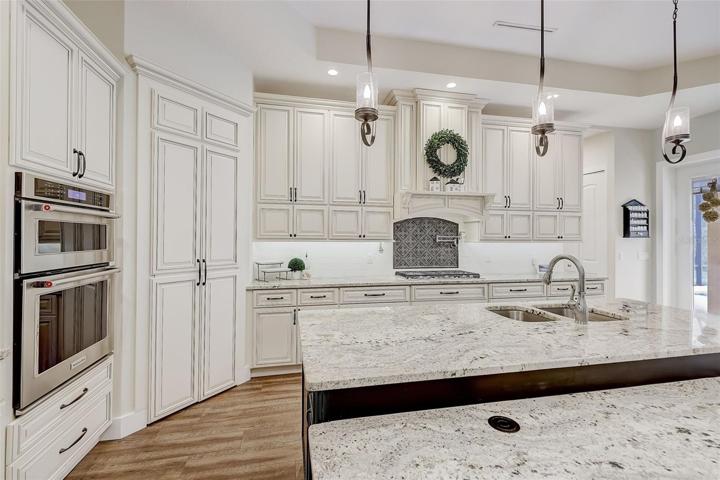 Kitchen has a hidden walk-in pantry door