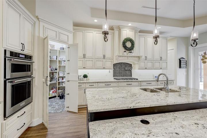Kitchen has a hidden walk-in pantry door