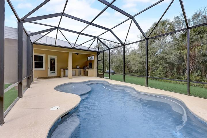view from pool to the outside kitchen