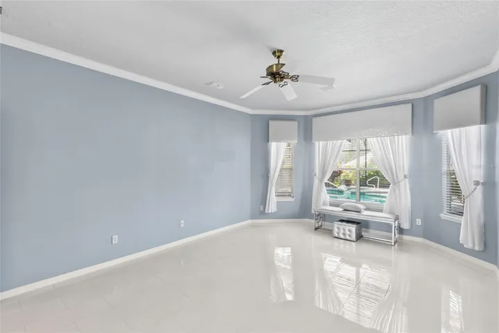 Master Suite (notice beautiful window treatments and windows overlooking Lanai-Pool area