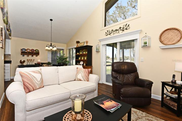 Living/Great Room-Vaulted Ceilings-Hurricane Sliding Doors to Screened Porch