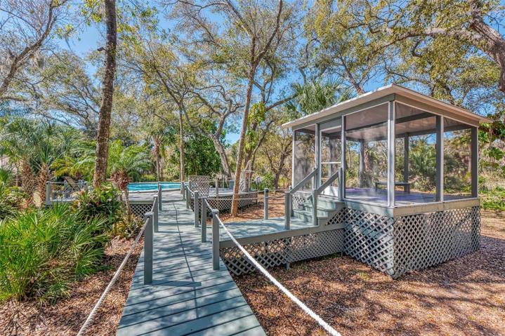Boardwalk to the screened gazebo and the pool