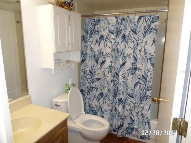 Bathroom with updated toilet and wall cabinet