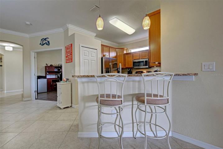 Breakfast bar provides seating for two in the kitchen, or guests to sit and talk while the cook is creating.