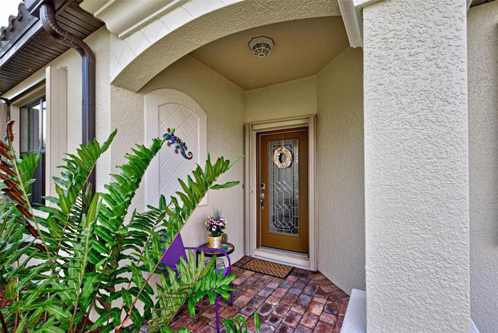 The entrance is welcoming with beautiful glass in the front door.