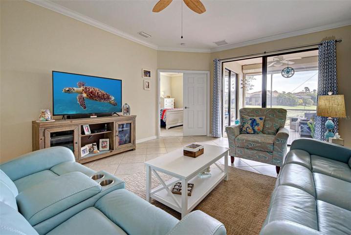 Large living room with plenty of space for your furniture.  As well as a open view out to the lanai and pond.