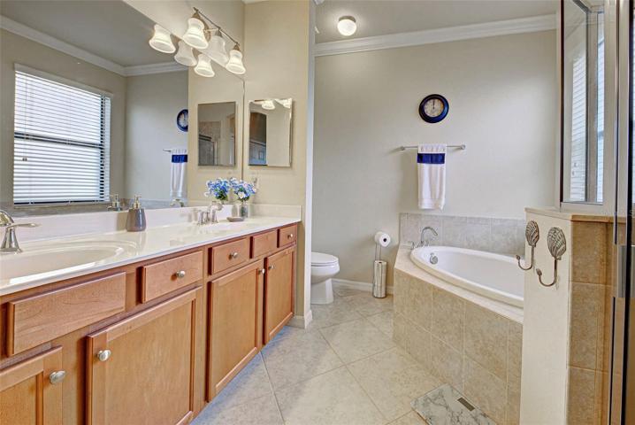 Double sinks and a garden tub are ideal for the primary bathroom.