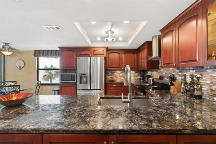 Nice stone counters and wood cabinetry