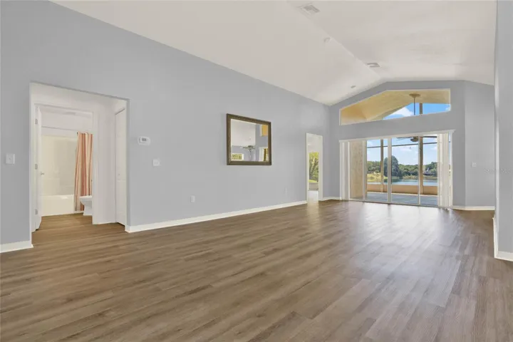 Living Room features Oversized Glass Sliding Doors