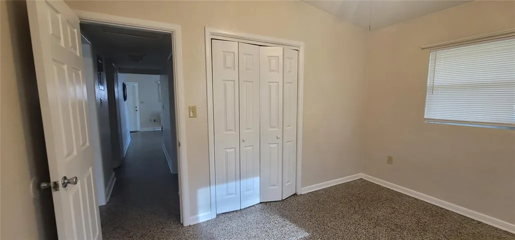 Bedroom 2 , with views down the hallway to your Living Room. Bathroom on the left!