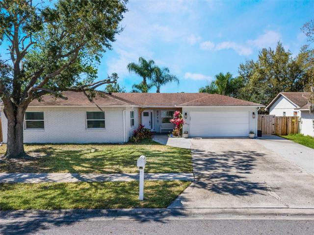 Front of home. Exterior paint 4 years old. Extended driveway. Updated lights, entry, and doorway, plus gutters :) Roof replaced in 2015.