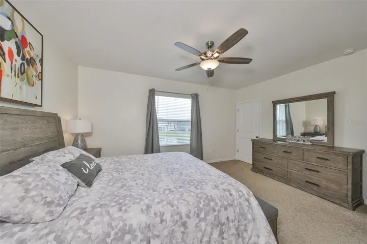 Primary bedroom with lots of room for a King-sized bed and furniture.  NOTE:  HIS closet is in the back right corner.