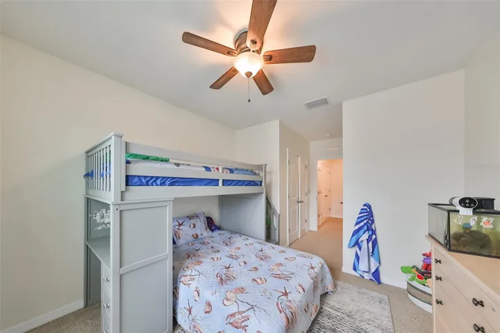 Bedroom 3 has a large closet for toys, clothes and storage with a lovely ceiling fan.