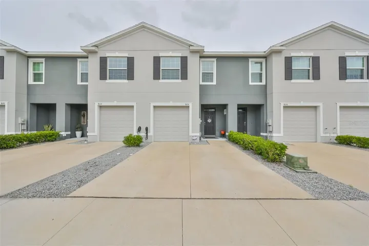 Two story unit offers beautifully manicured front entrance.