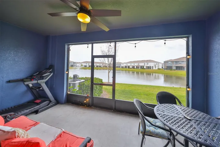 What a view!!  Outdoor screened patio lanai with custom ceiling fan and edison light bulbs for accent.