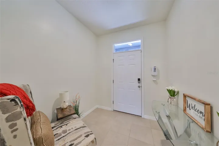 Front foyer entrance with a window to allow natural Florida sunshine into the room.