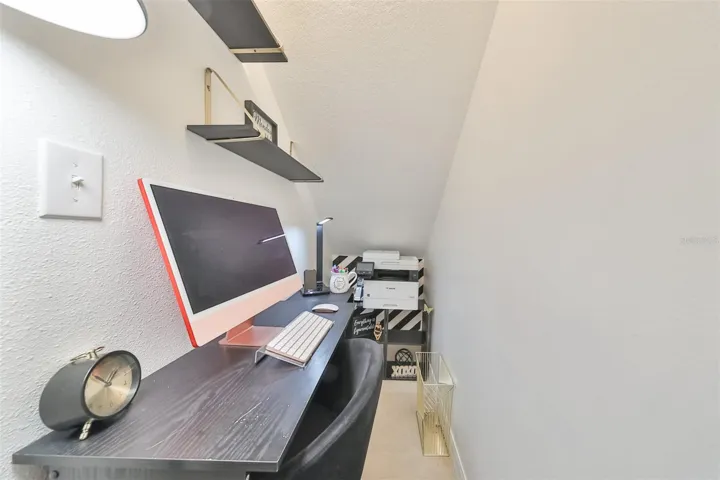 Cozy office nook under the stairs on the ground floor.