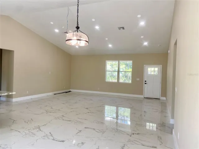 dining area to great room with porcelain tile