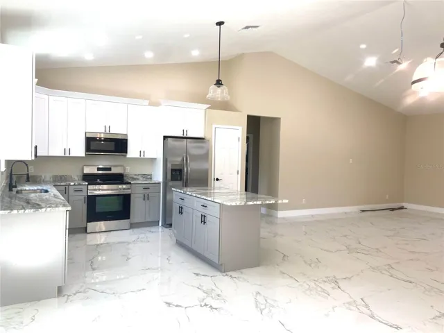 kitchen with island, stainless appliances